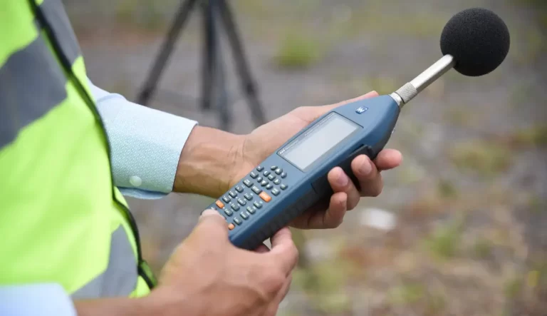 Acoustics Consultant using sound-level meter