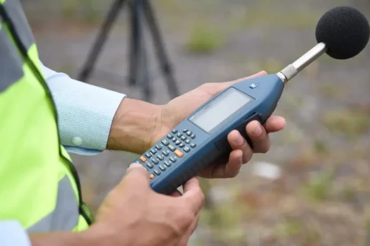 Acoustics Consultant using sound-level meter